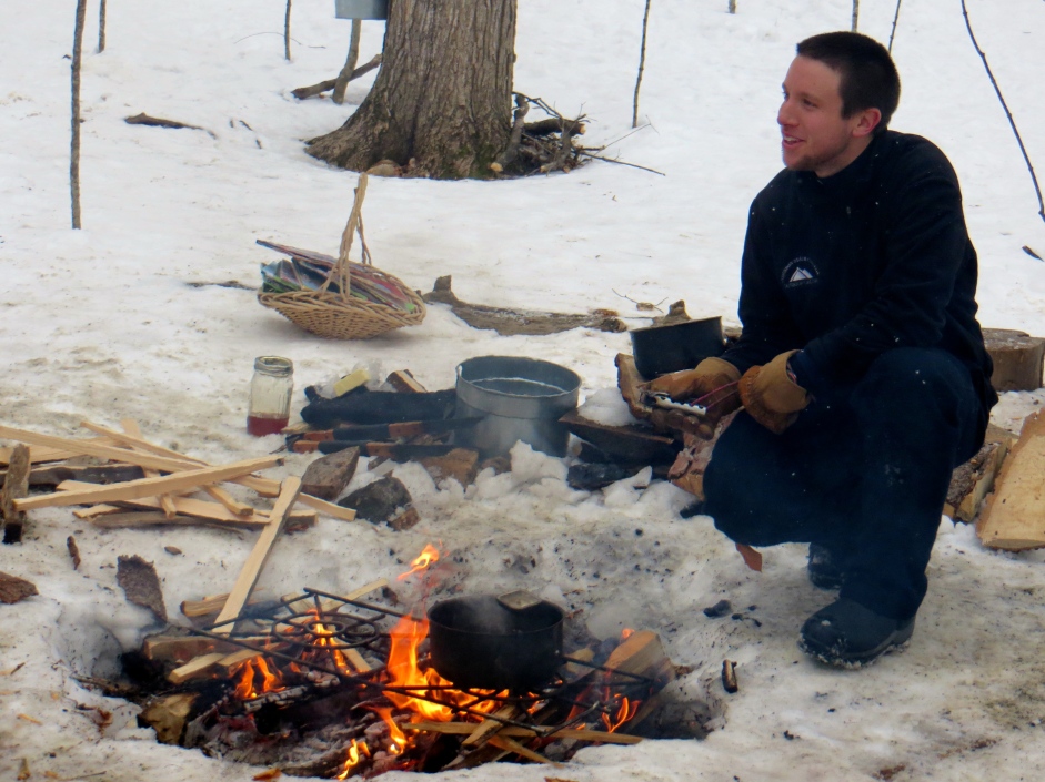 Heating maple syrup for sugar on snow